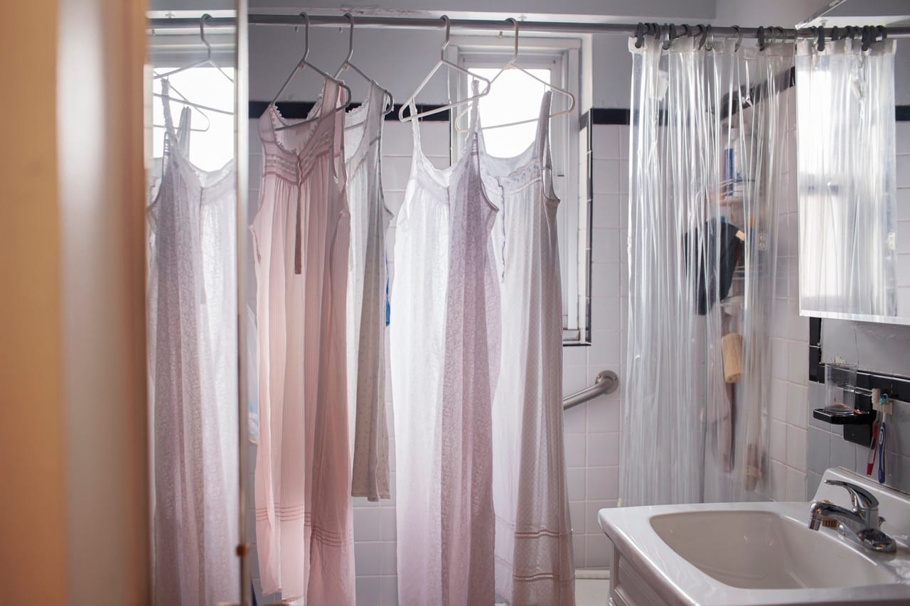 Claire Gottfried's nightgowns dry in her bathroom in the Chelsea development Penn South, New York City. April 3, 2014.