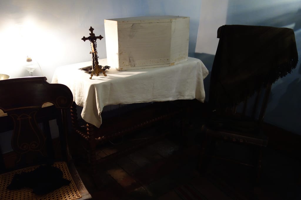 A wake for a child in the Moore family apartment