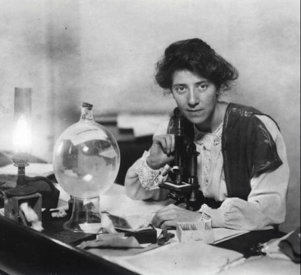 Photograph of Marie Stopes in her lab with microscope. (courtesy Wellcome Library)