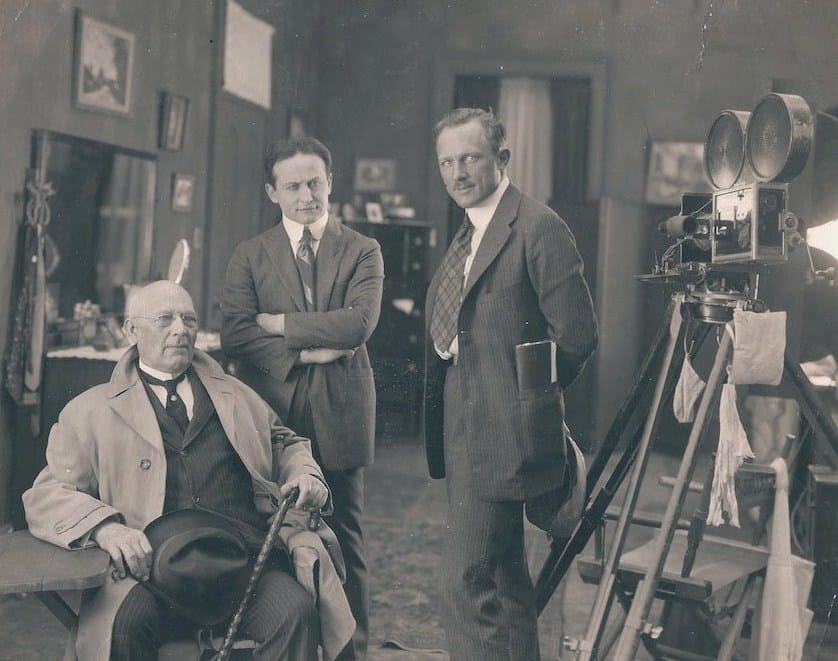 On the set of 'The Grim Game' (1919). L to R: magician Harry Kellar, Harry Houdini, & director Irvin Willat (Paramount/Arthur Moses Collection, via Wikimedia)