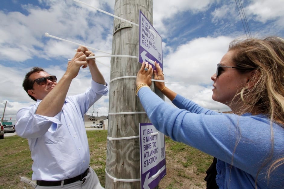 Installing wayfinding signs in Atlantic Beach, North Carolina (courtesy Walk [Your City])