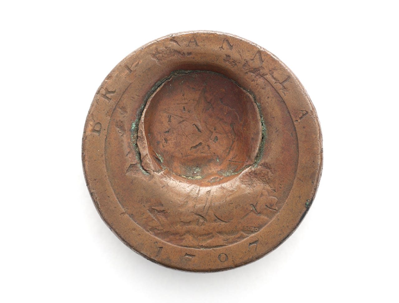 A penny dented by a bullet, saving a British soldier at Waterloo (courtesy National Army Museum)