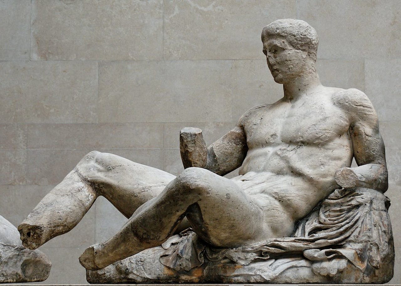 A reclining Dionysos, from the Parthenon's east pediment (c. 447–433 B.C.) (Image via Wikimedia) 