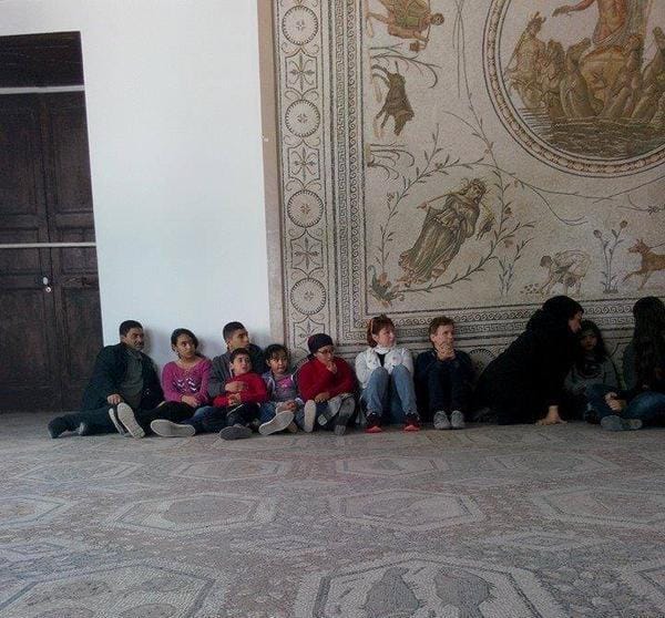 "A group of frightened looking kids are among the hostages inside the Bardo Museum." (photo via ILNewsFlash/Twitter)