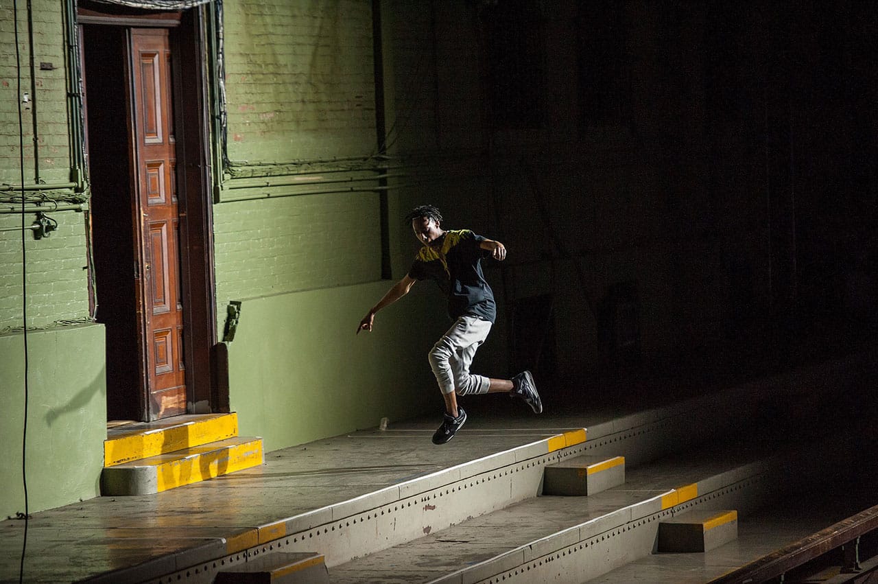 Sean "Brixx" Douglas dancing on the mezzanine in 'FLEXN' at Park Avenue Armory