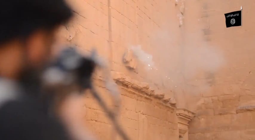 ISIS fighters shoot Roman-period sculptures in Hatra.