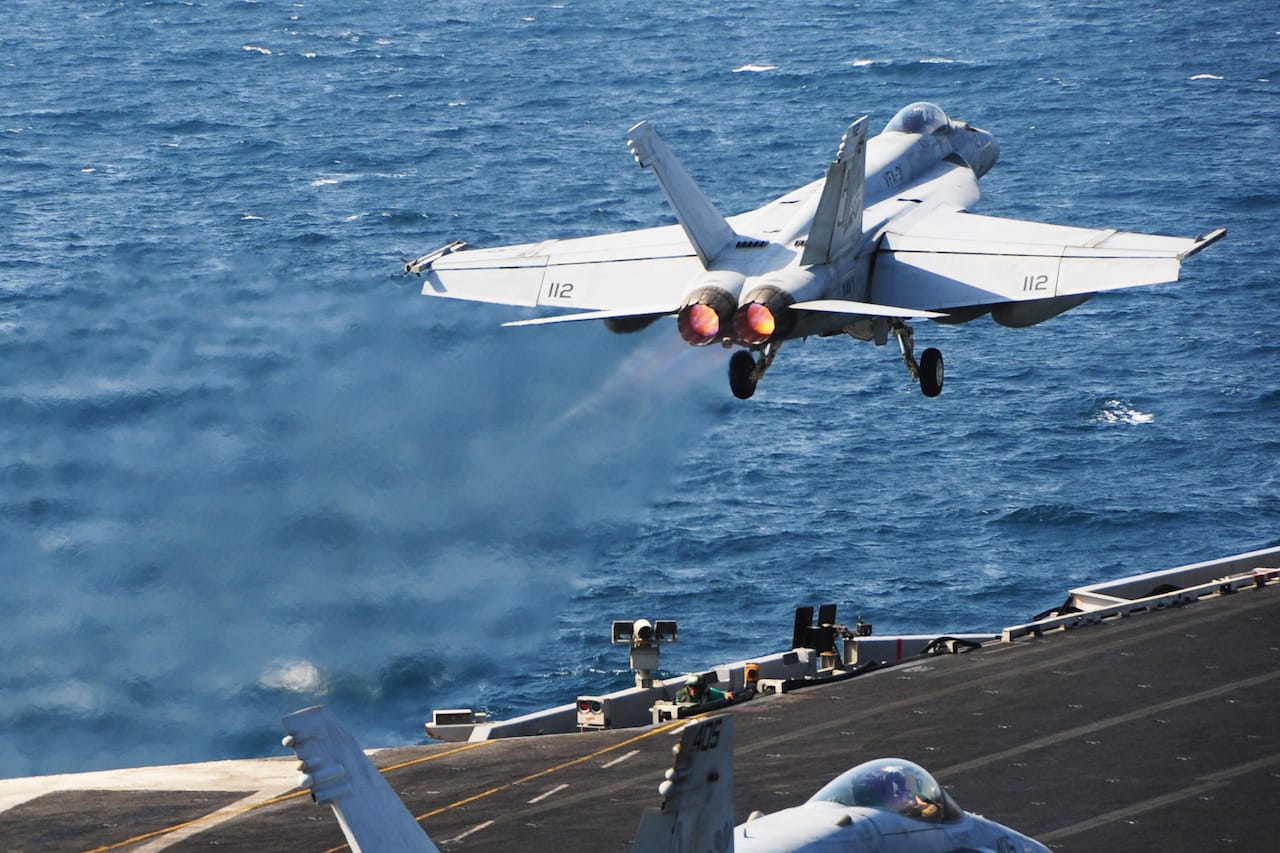 ARABIAN GULF (Oct. 13, 2014) An F/A-18E Super Hornet assigned to the Tomcatters of Strike Fighter Squadron (VFA) 31 launches from the flight deck of the aircraft carrier USS George H.W. Bush (CVN 77). George H.W. Bush is supporting maritime security operations, strike operations in Iraq and Syria as directed, and theater security cooperation efforts in the U.S. 5th Fleet area of responsibility.  (U.S. Navy photo by Mass Communication Specialist 3rd Class Joshua Card/Released) 141013-N-CZ979-097 Join the conversation http://www.navy.mil/viewGallery.asp http://www.facebook.com/USNavy http://www.twitter.com/USNavy