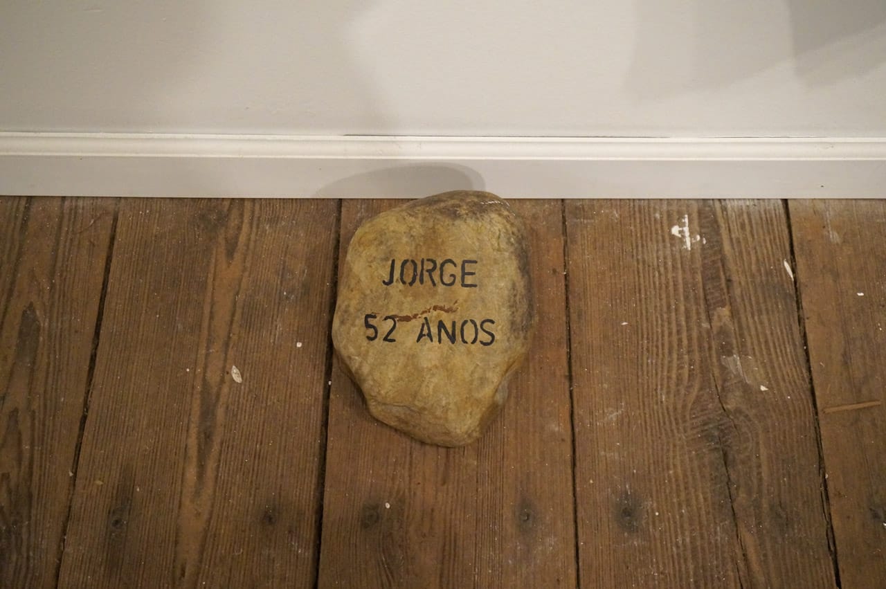 Flavia Berindoague, detail of "The Storytellers" (2014), institutional blanket, acrylic paint, stone, and nail, 7.5 x 6 ft (click to enlarge)