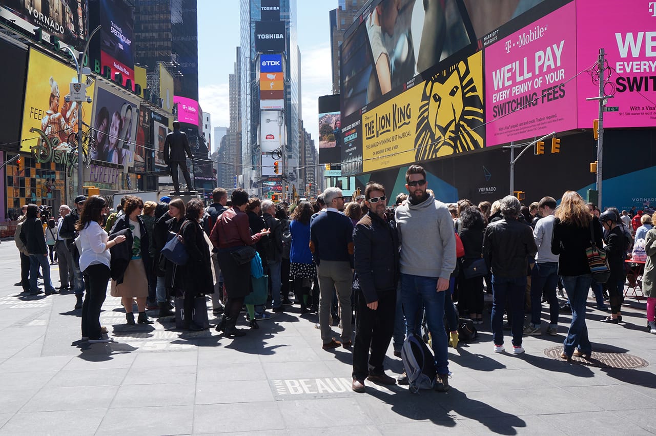 Tourists taking a photo in front of the event