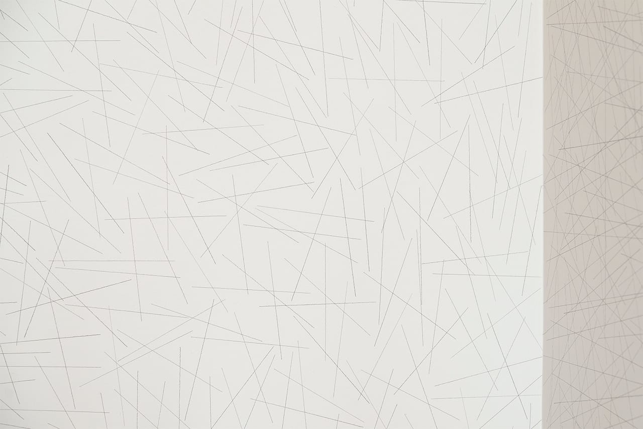 Sol LeWitt Wall Drawing #109, 1971, 2015 (detail) ten thousand random straight lines on each of two walls in black pencil. Left wall: 5 inches long, right wall: 10 inches long Drawn by Nobuto Suga, Lynne Woods Turner, Storm Tharp and Sarah Miller Meigs photograph by Evan La Londe