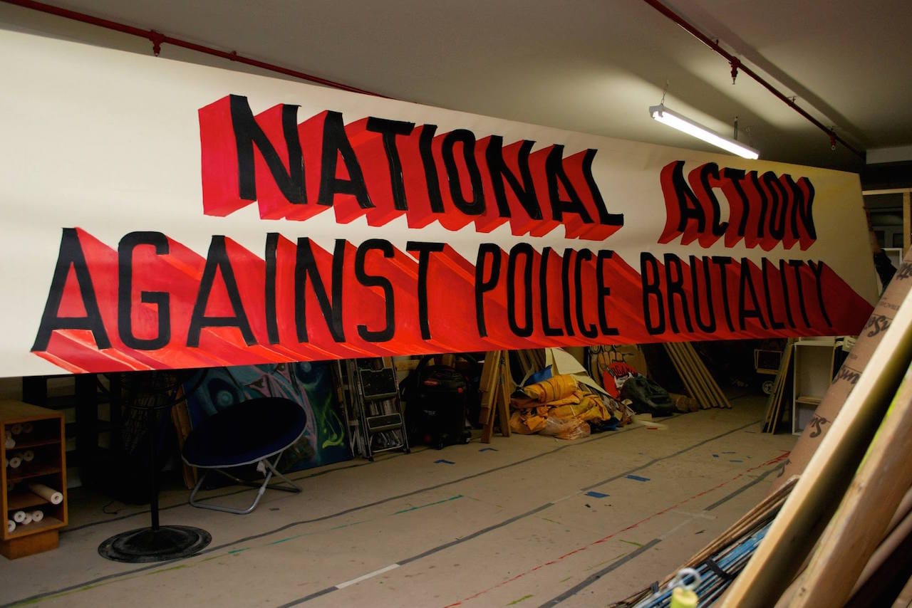 Banner for O22 Nat day against police brutality (photo courtesy People's Climate Arts)