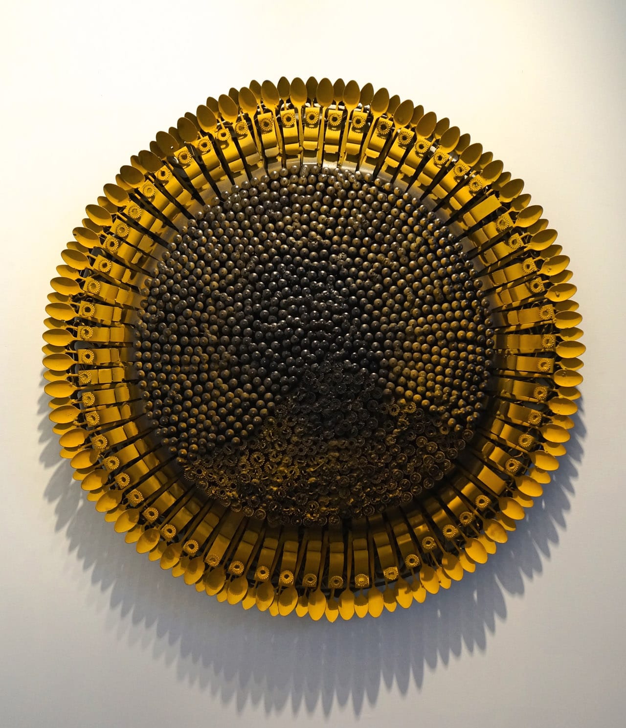 Olu Amoda, "Medium Sunflower iii" (2014), blind revert, steel belt, mild still pipe, 52 x 52 in, at the booth of Art Twenty One