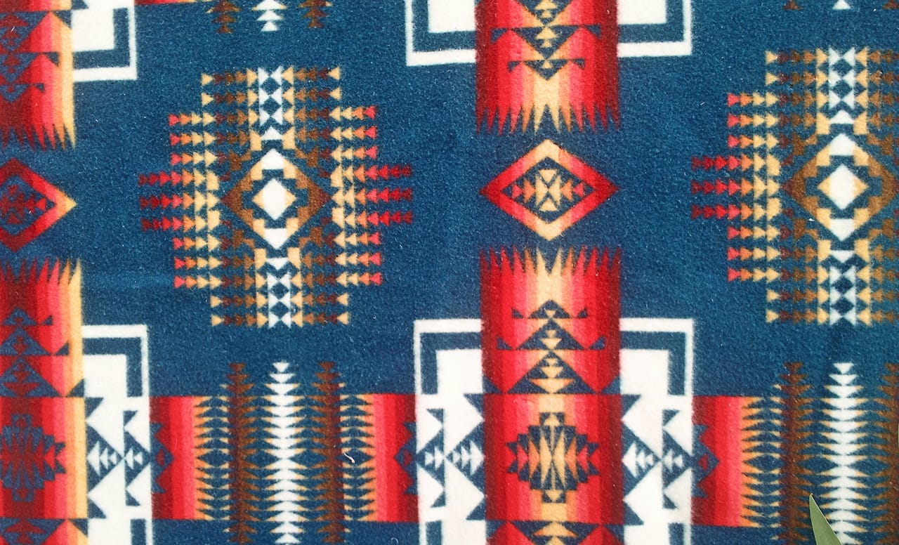 Detail of a Pendleton blanket with "Native American inspired" design (photo by Flickr user Calsidyrose)