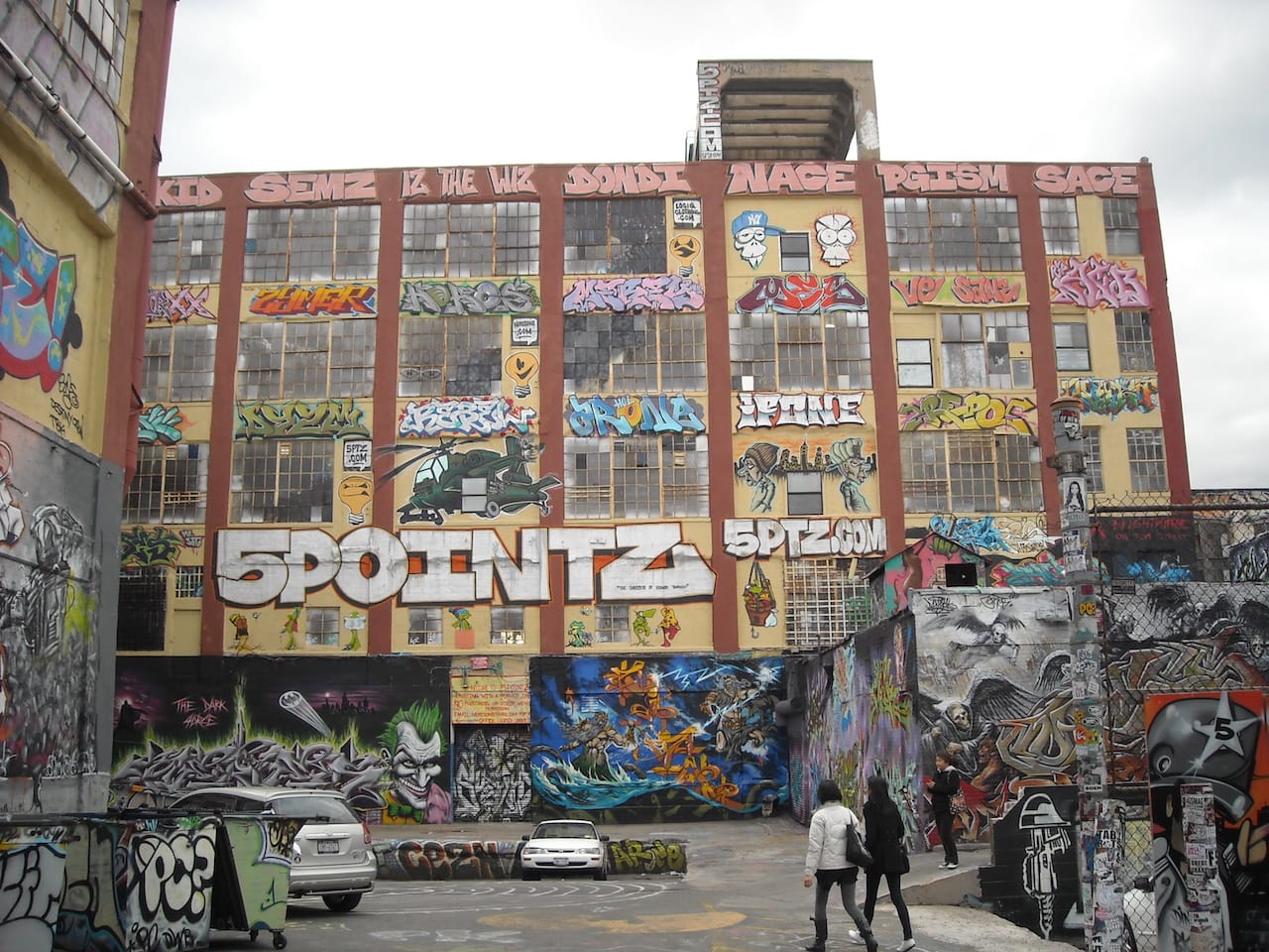 The rear entrance of 5Pointz in 2010 (photo by Eco84, via Wikimedia Commons)