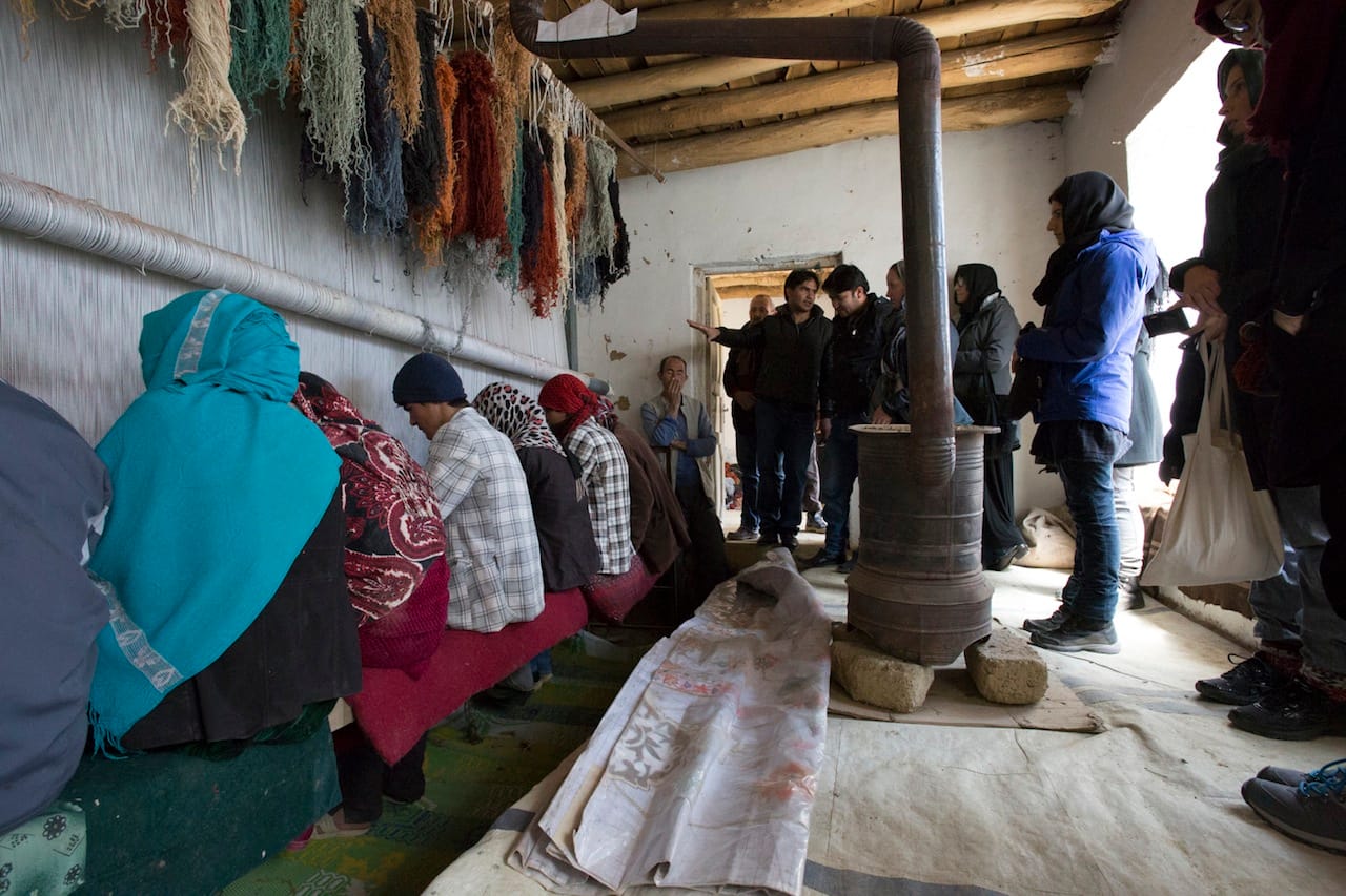 Visiting a weaving studio in Bamiyan, Afghanistan. Photo: Lisa Anne Auerbach (via hammer.ucla.edu)