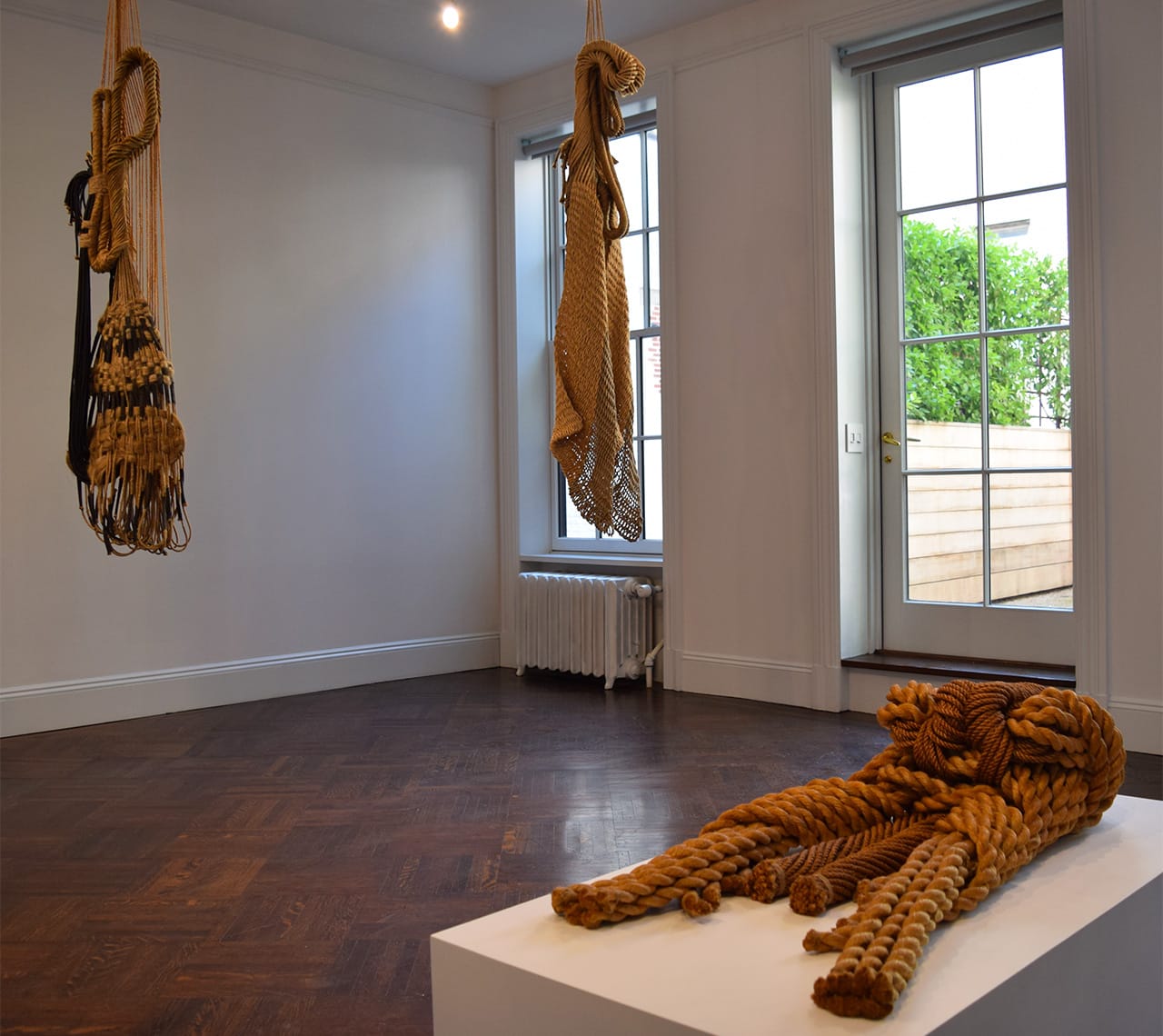 Installation view with Françoise Grossen's "Euphrosyne" (1991, left), "Thalia (all natural)" (1991, center), and "Sisyphe" (1974, right)