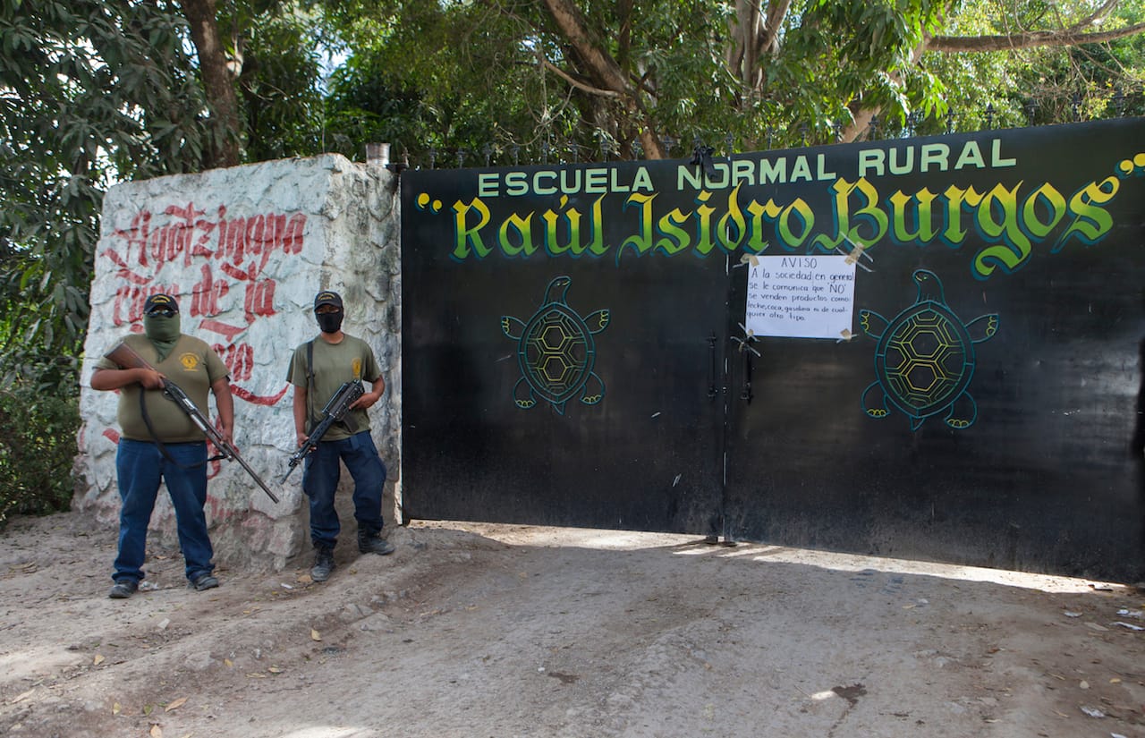 Armed and masked community members protect the remaining students of the Raúl Isidro Burgos Rural Teachers' College of Ayotzinapa