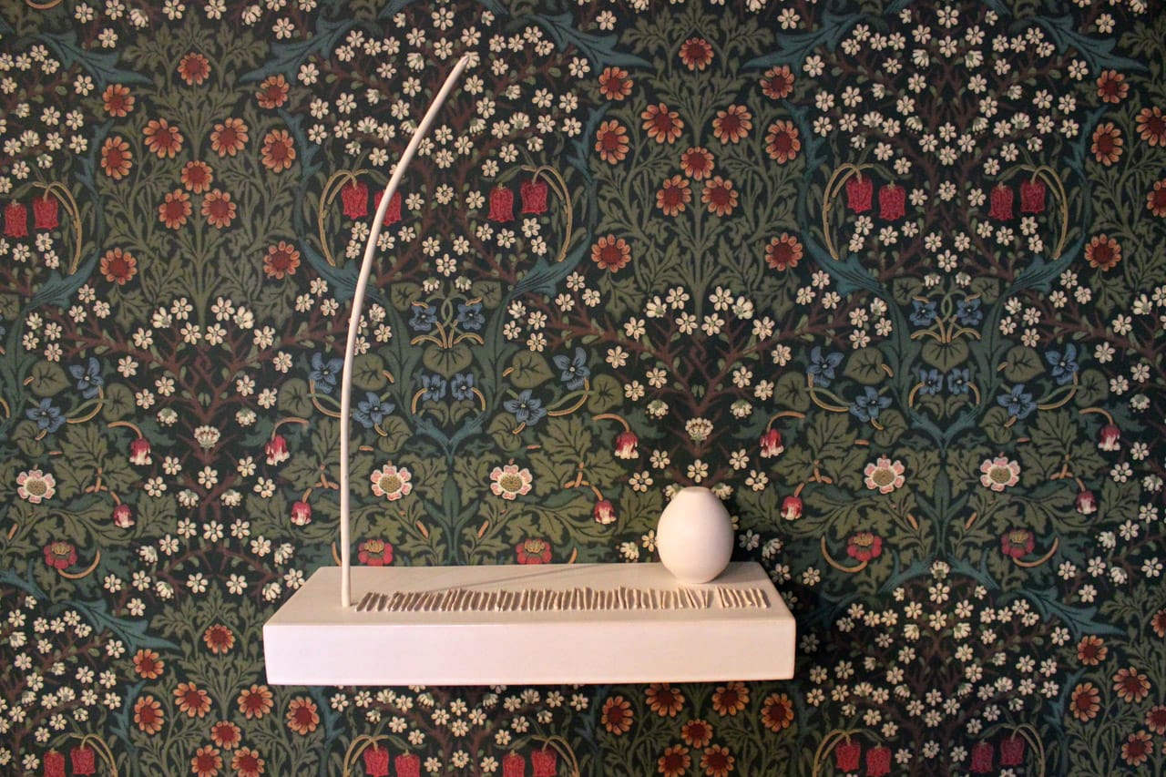 Hermann's delicate lines and forms are rendered flat against the colorful chaos of William Morris' "Blackthorn" wallpaper (all photos by the author for Hyperallergic unless otherwise noted) 