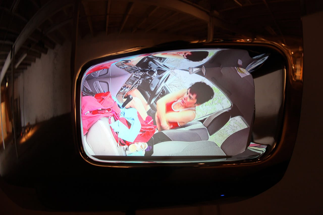 Still from one of Melanie Mano's headlight feeds in 'Detroit Boom City' (all photos by the author for Hyperallergic)