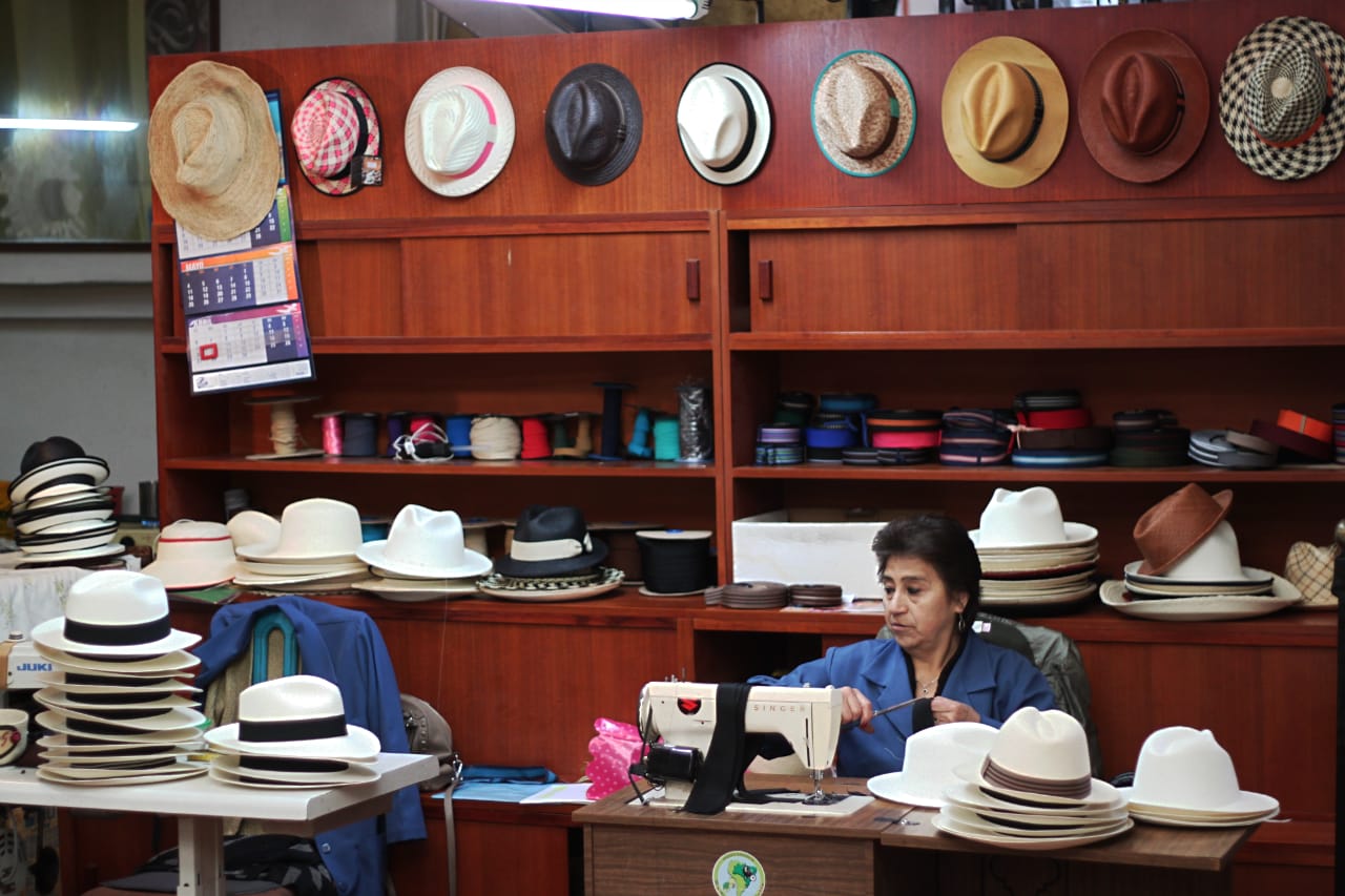 The final details are added to the hats in Cuenca’s factories.