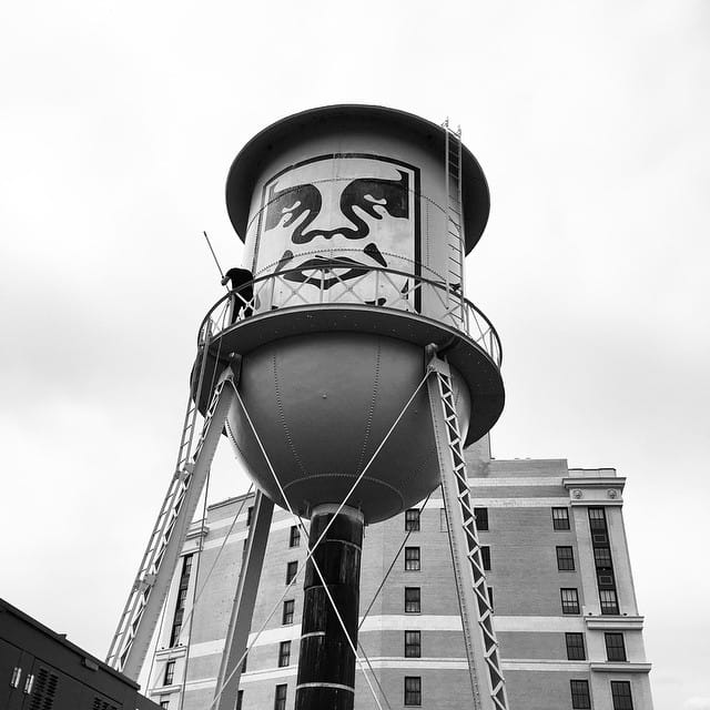One of Shepard Fairey's Andre the Giant wheatpaste posters on a water tower in Detroit last month. (photo by obeygiant/Instagram)