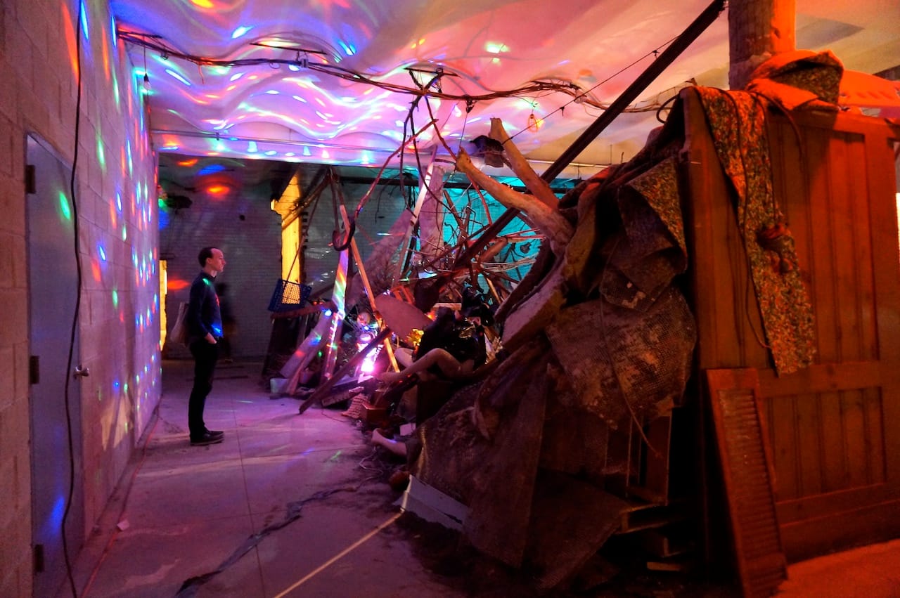 Abigail Deville, "...and justice for all?" (2015), on-site construction debris, broken marble, branches, reclaimed wood, dead Christmas trees, accumulated debris, heirlooms, TVs, computer monitors, phones, oven