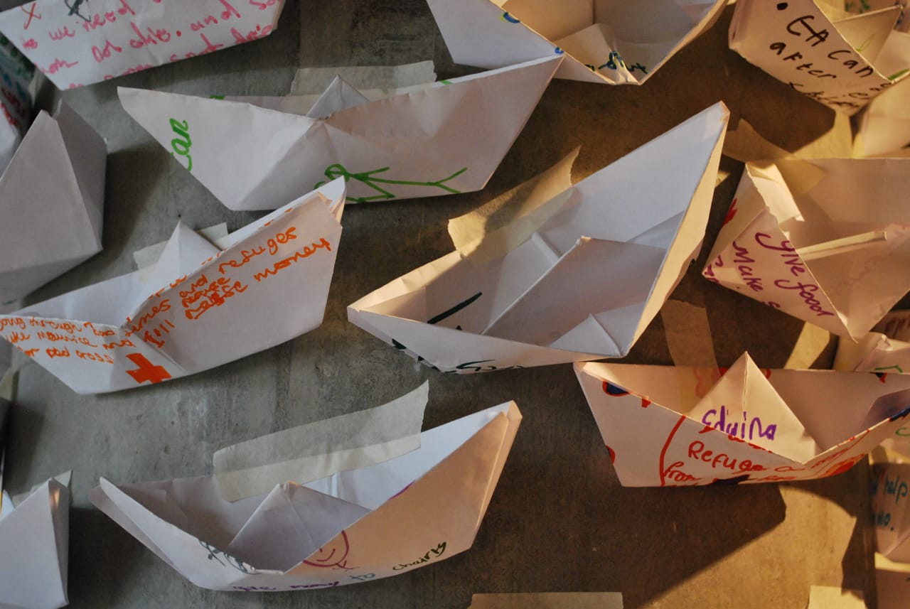 Installation shot of paper boats made by children at Hackney Museum.