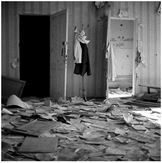 James Hill. A dove was attached to a coat stand in the ruins of School No. 1, Beslan, North Ossetia, September 2004
