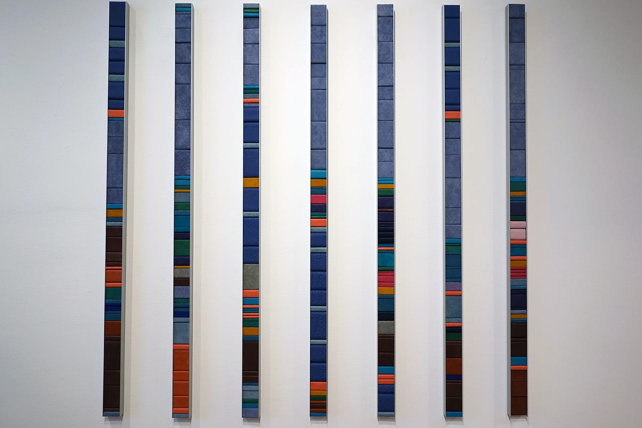 Laurie Frick, "7 Days of a Man 37" (2015), leather, wood, and aluminum, 48 x 50 inches; Time-use data of a man age 37 over 7 days