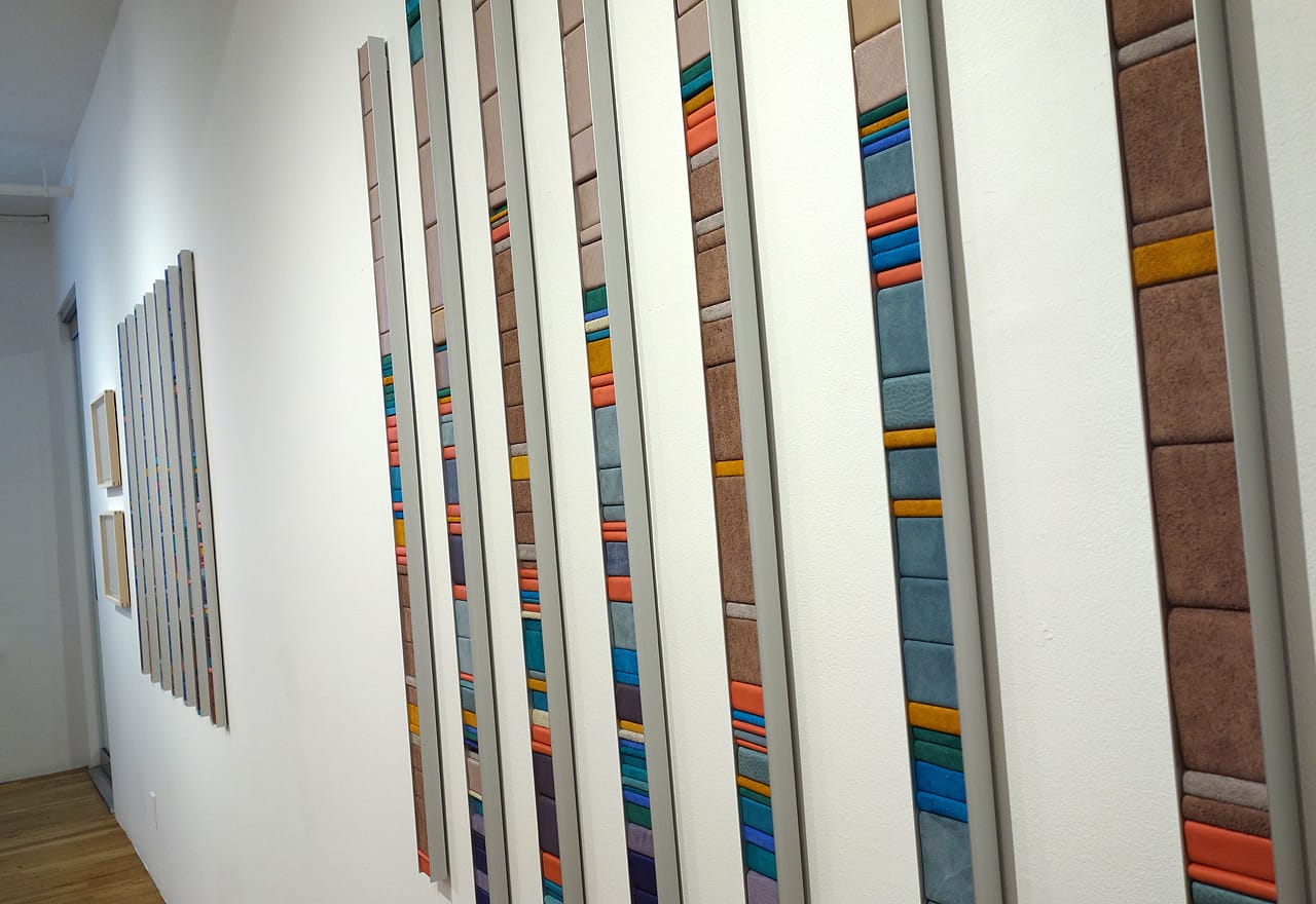 Laurie Frick, "7 Days of a Woman 32" (2015), leather, wood, and aluminum, 48 x 50 inches; Time-use data of a woman age 32 over 7 days