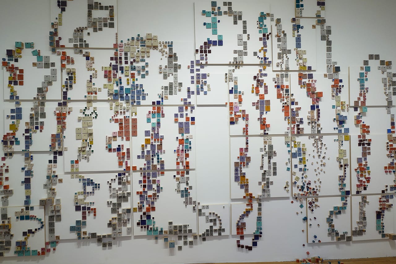Laurie Frick, "14 Days" (2015), wood block, tacks, leather on wall, and canvas primed panels, 108 x 168 inches; 14 days of time-use tracking, color coded by activity