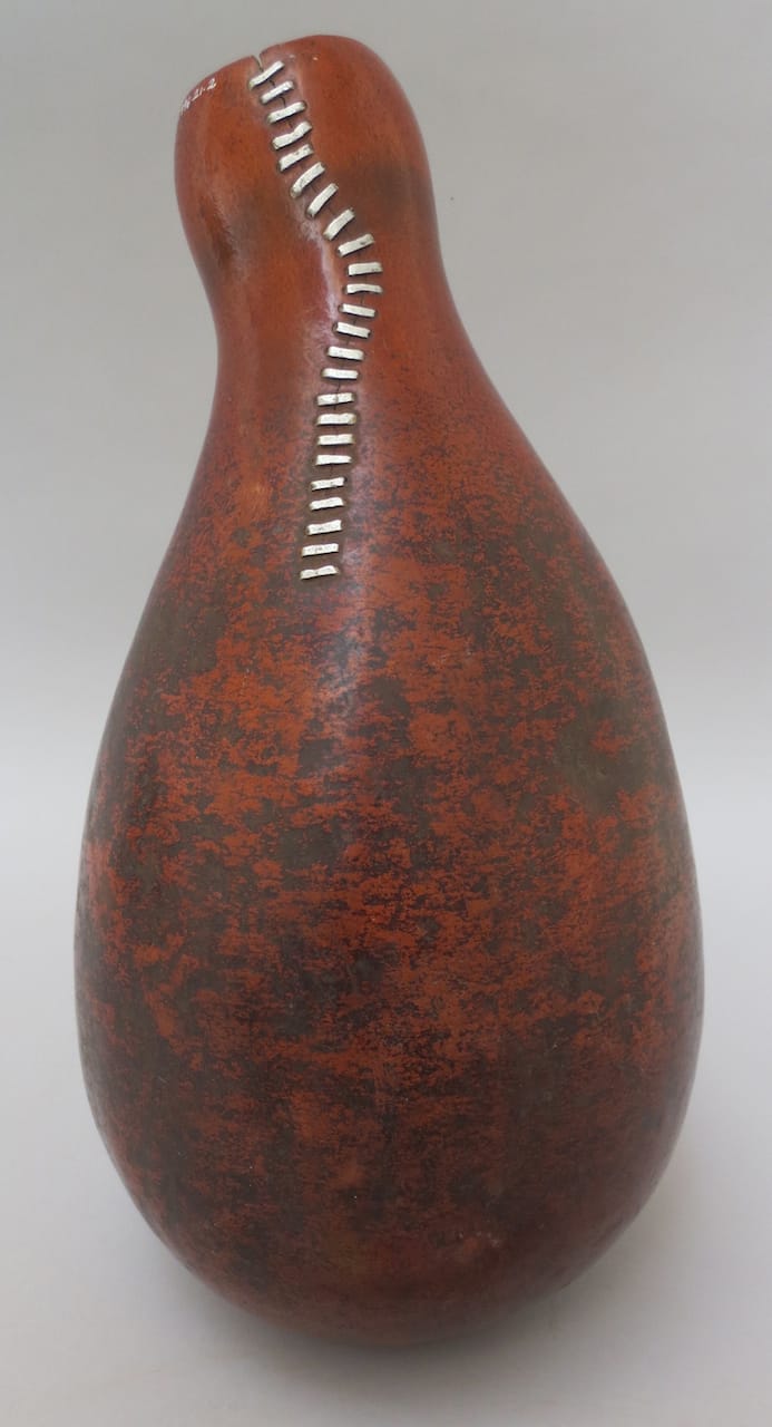 Gourd vessel from Kenya or Tanzania with a long, vertical, crack in the neck repaired with metal staples (courtesy Pitt Rivers Museum, University of Oxford)
