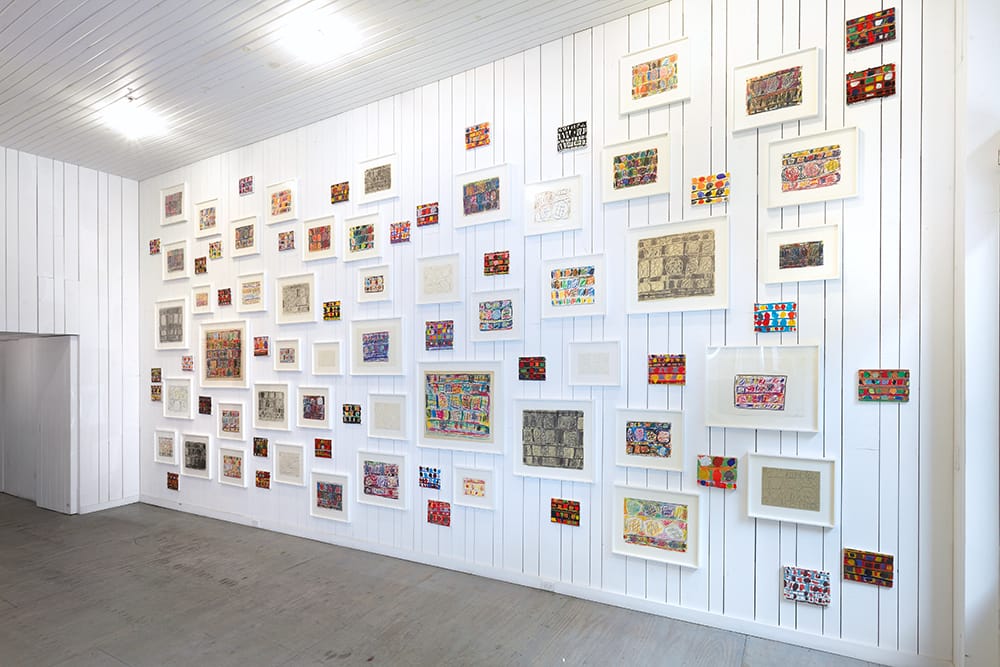 An installation view of 80 works on paper and canvas (1990) by Stanley Whitney