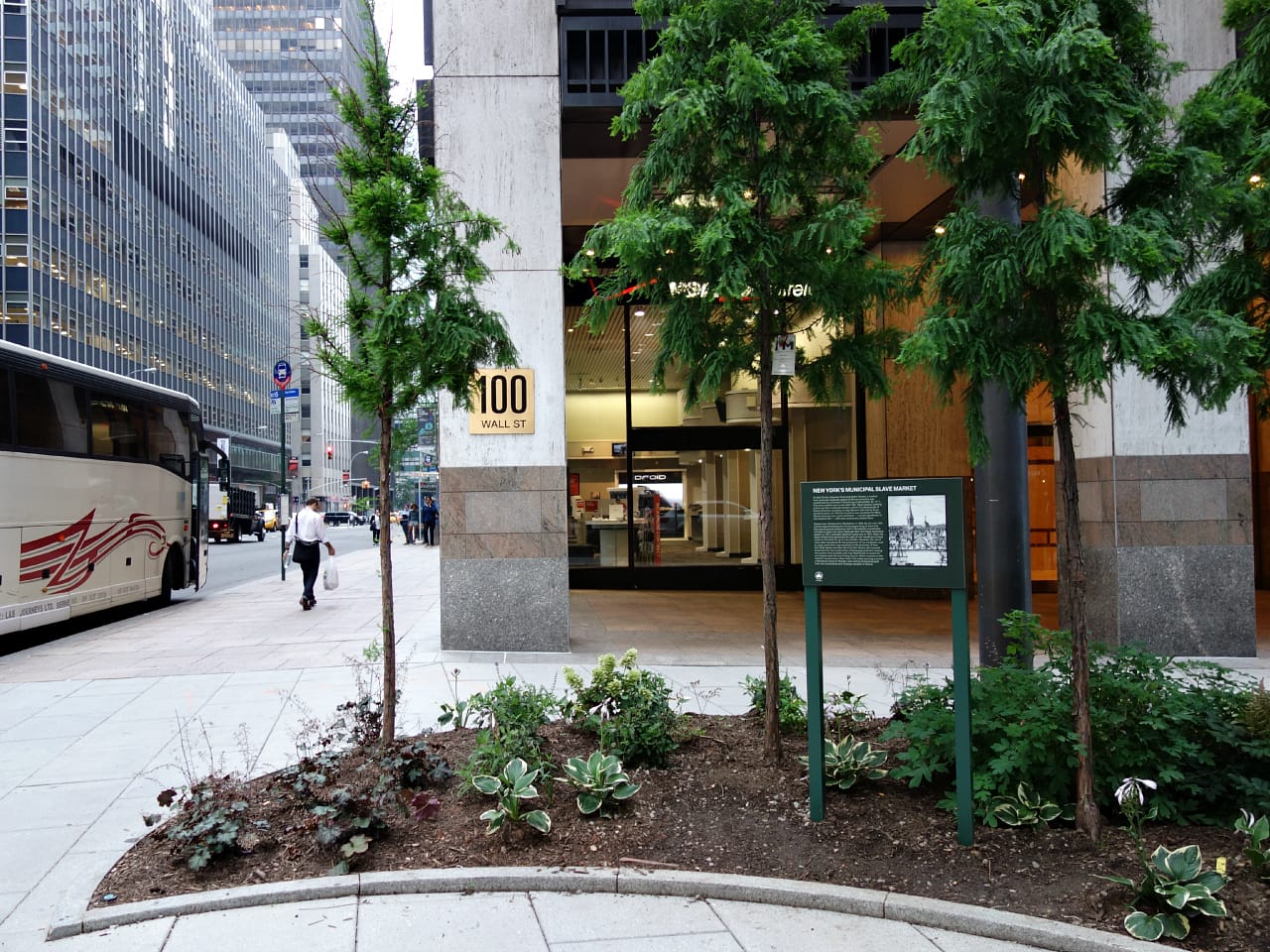 Plaque remembering the Wall Street Slave Market installed at Wall Street and Water Street