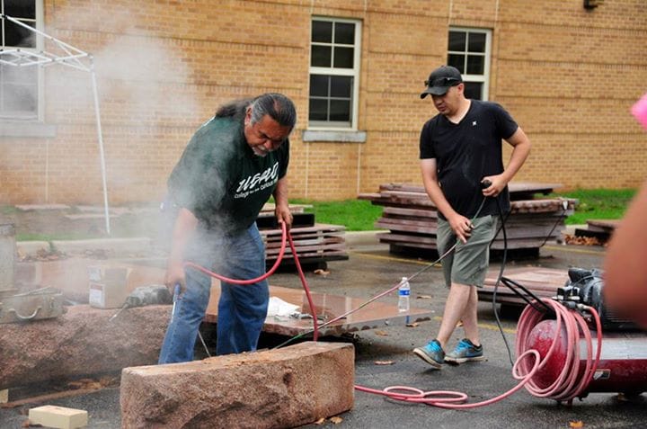 Jesús Moroles splitting granite for Coming Together Park at USAO