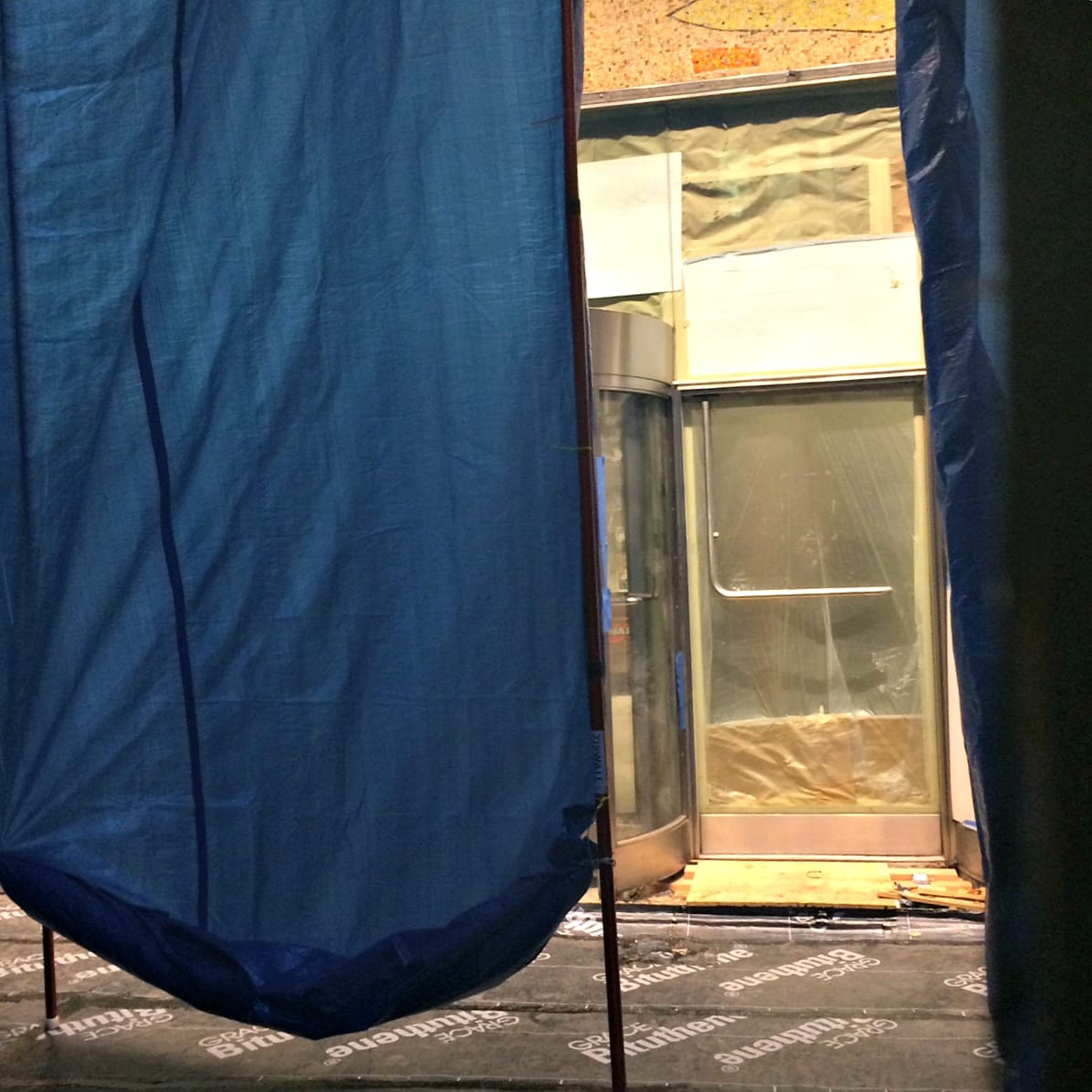 The mosaic covered with tarps after its discovery in March