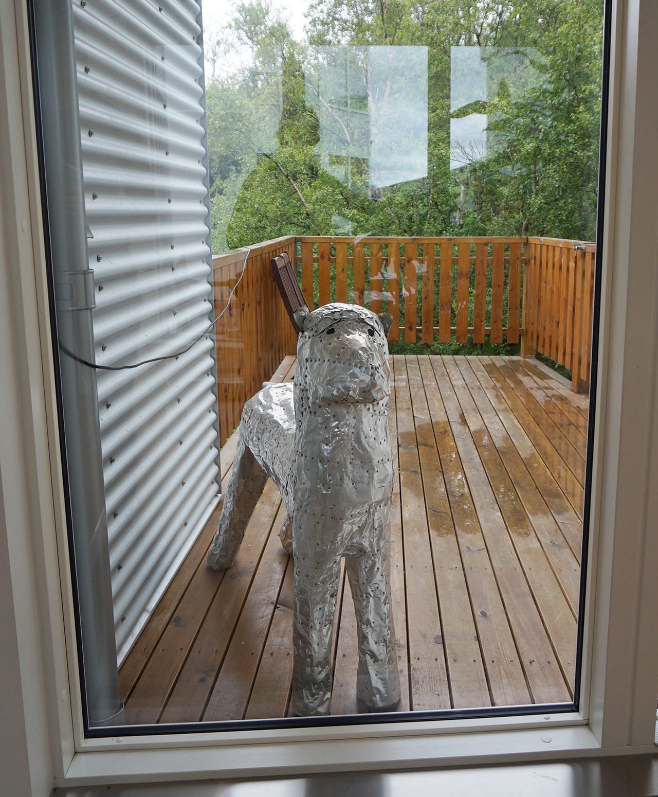 A dog sculpture at the door