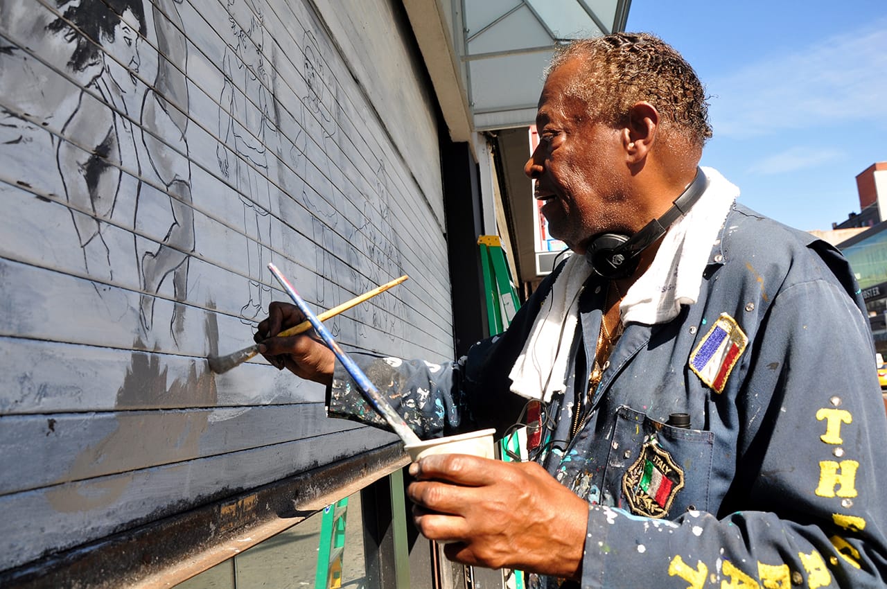 The Picasso of Harlem at work on the Children's Place mural (click to enlarge)