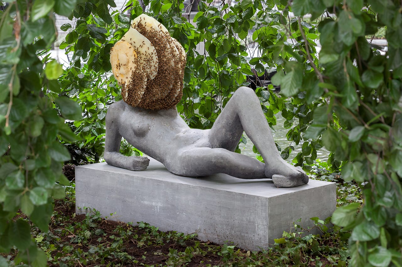 Pierre Huyghe. "Untilled (Liegender Frauenakt) [Reclining female nude]" (2012), concrete with beehive structure, wax, and live bee colony; figure: 29 1/2 x 57 1/16 x 17 11/16″ (75 x 145 x 45 cm), base: 11 13/16 x 57 1/16 x 21 5/8″ (30 x 145 x 55 cm), beehive dimensions variable, the Museum of Modern Art, New York, purchase (© 2015 Pierre Huyghe, photo by Jonathan Muzikar)