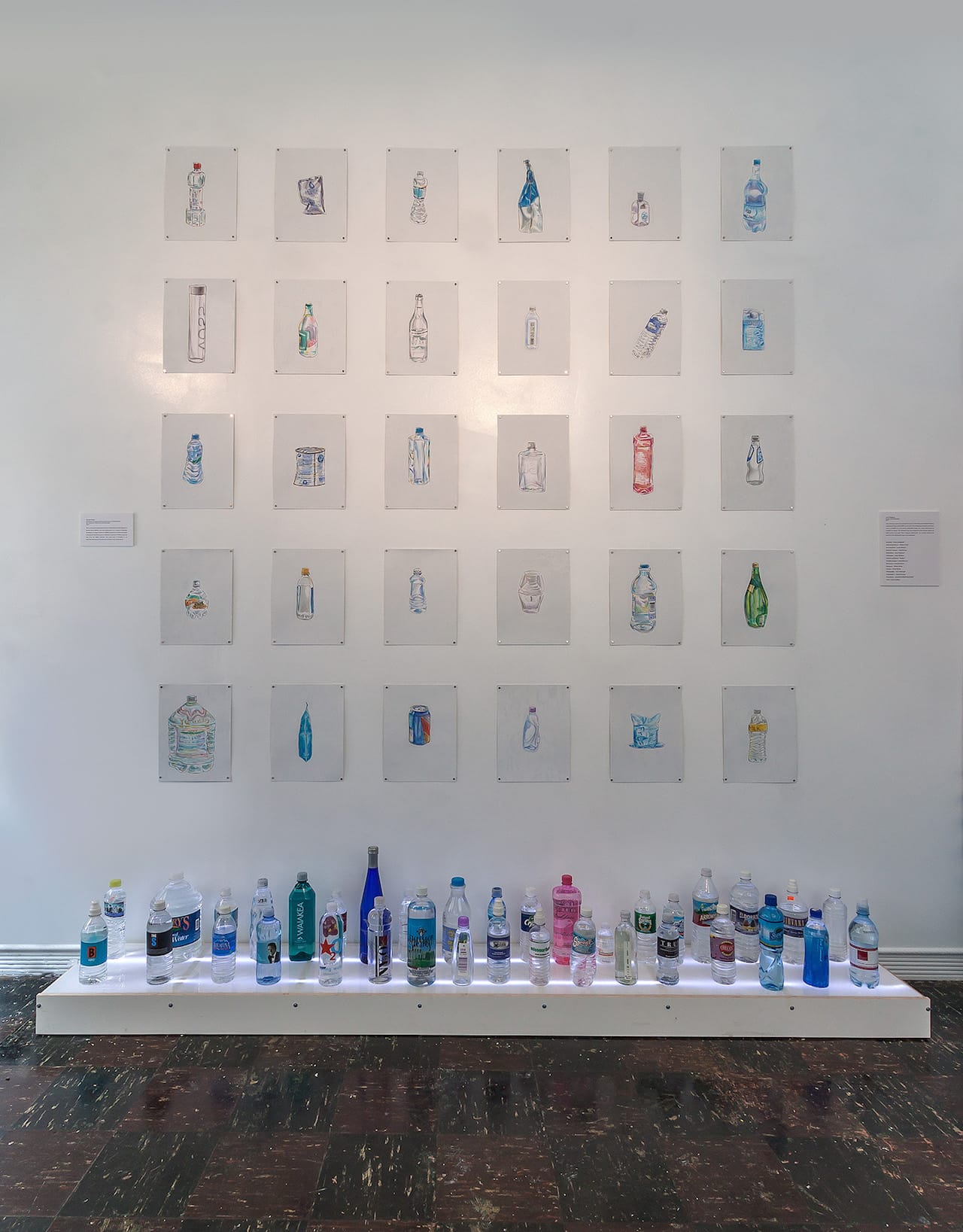 Bottles and drawings by Charlie Mylie on view at the Museum of Bottled Water in Kansas City