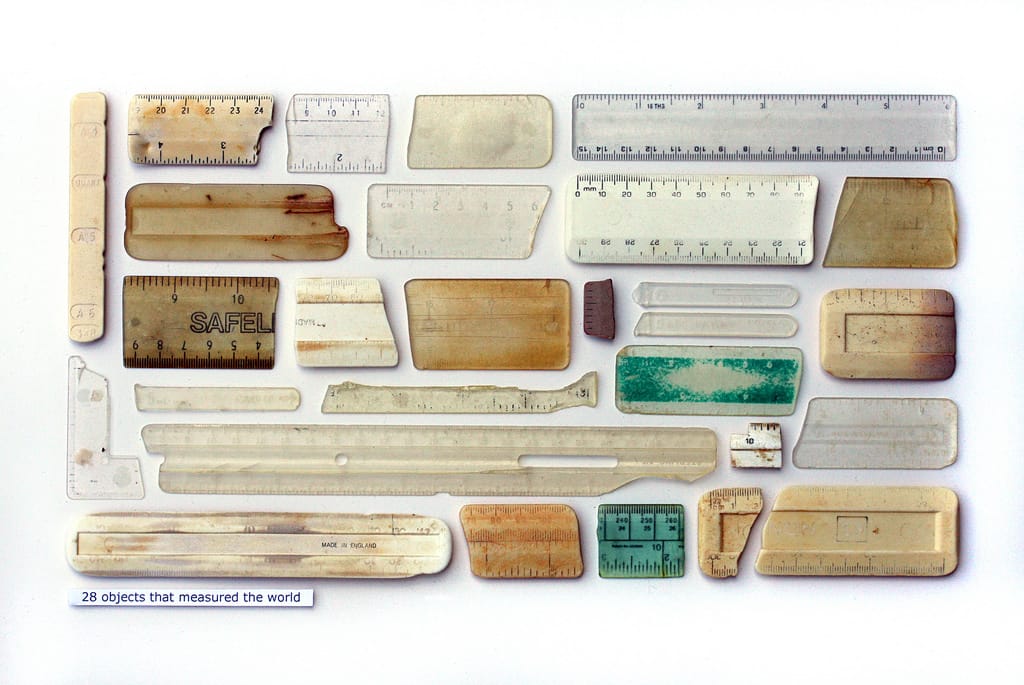 Steve McPherson, "28 Objects That Measured The World," plastic objects, entomology pins, text on card (courtesy the artist) 