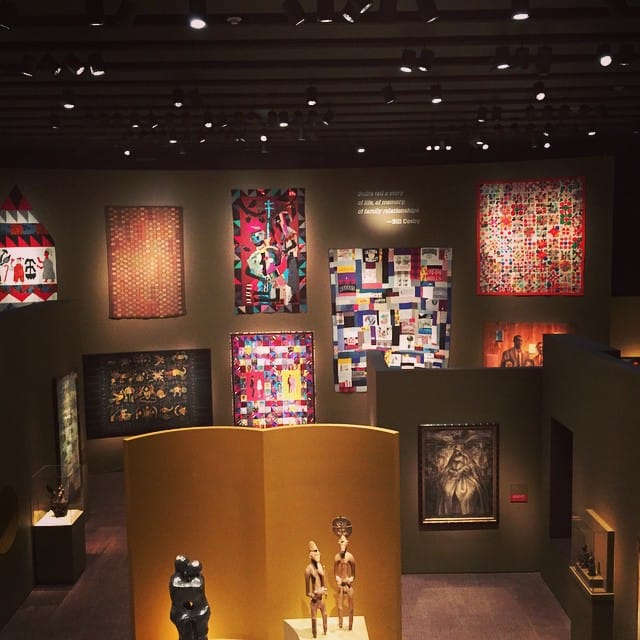 A wall of quilts owned by the Cosbys, on view in "Conversations" (photo by @pjburls/Instagram)