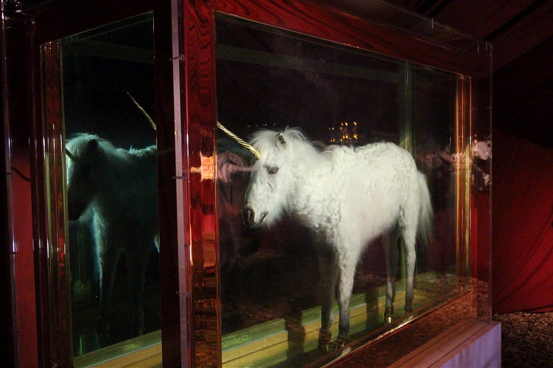 In the back of a darkened tent, you can find this sculpture by Damien Hirst. (photo by @sashabogojev)