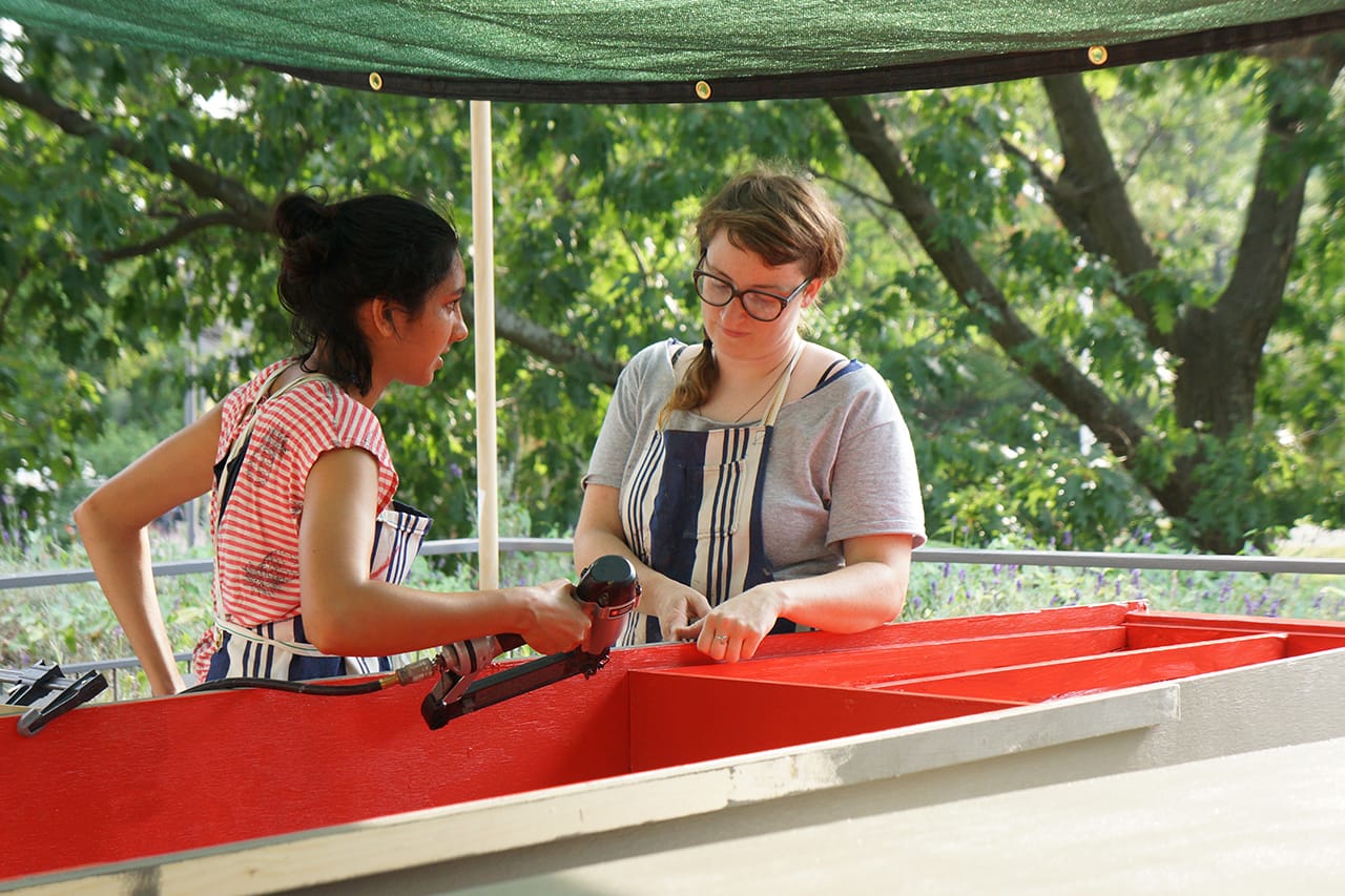 Members of Mare Liberum working on boats at the Carpenter Center (click to enlarge)