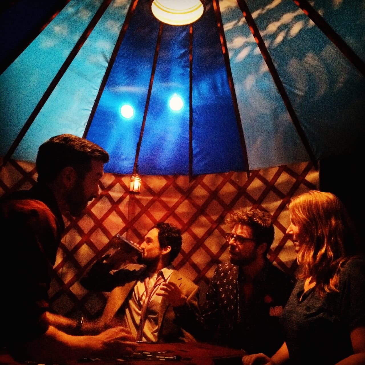 Jamie Effros, Todd D'Amour, Justine Perez, and an audience member in Empire Travel Agency (photo by Caroline Azano)
