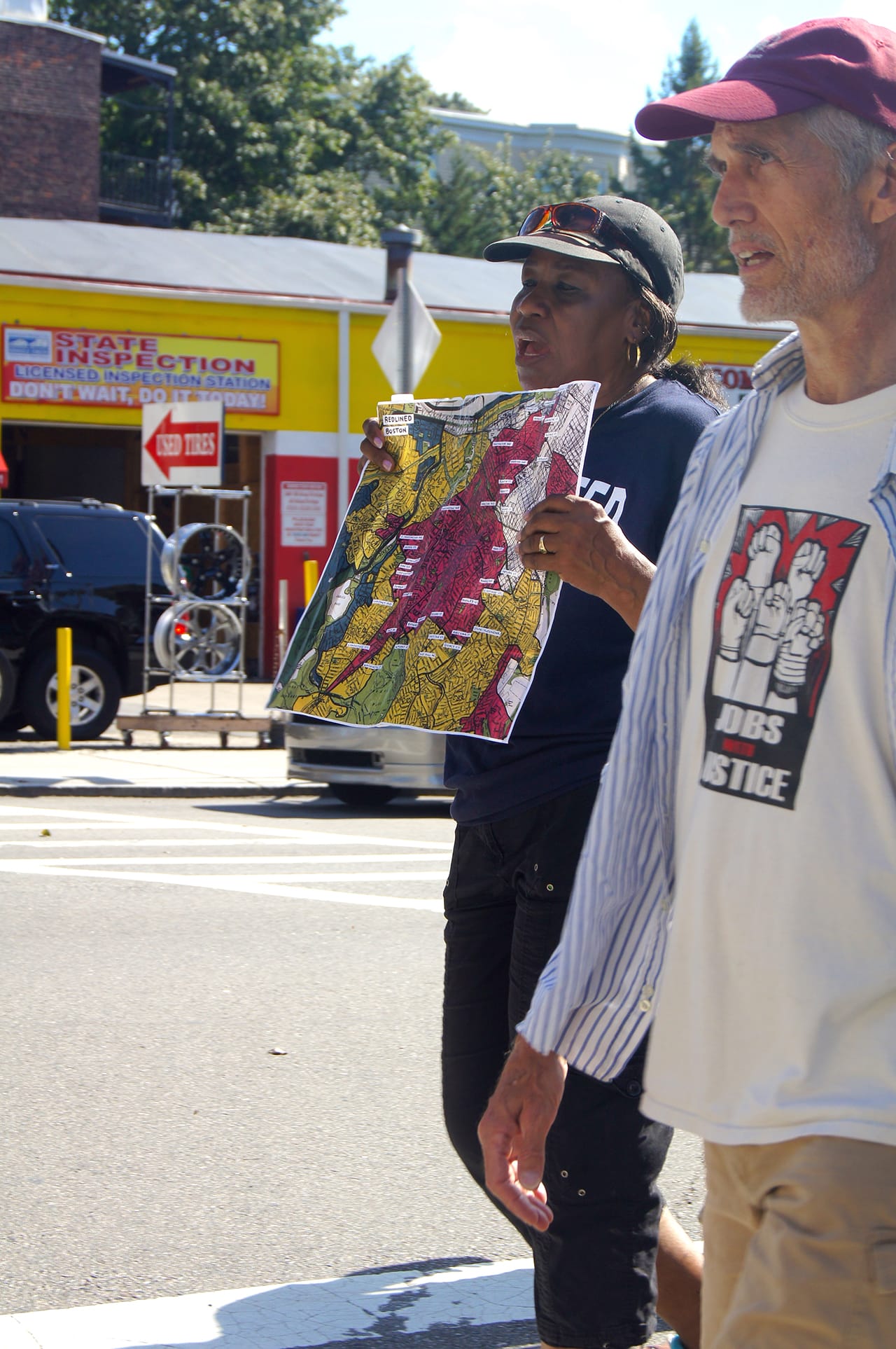Heather Gordon walks with City Life volunteers to educate passersby. (click to enlarge)