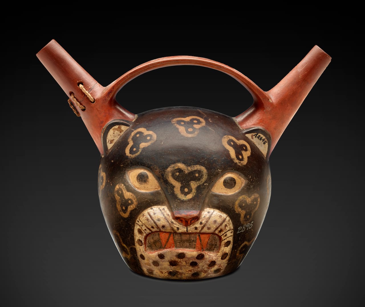 A double-spouted jar with the face of a jaguar, made in the Paracas culture (800– 100 BCE). Ceramics like this were often buried with the mummified dead (© 2015 The Field Museum, photo by John Weinstein)