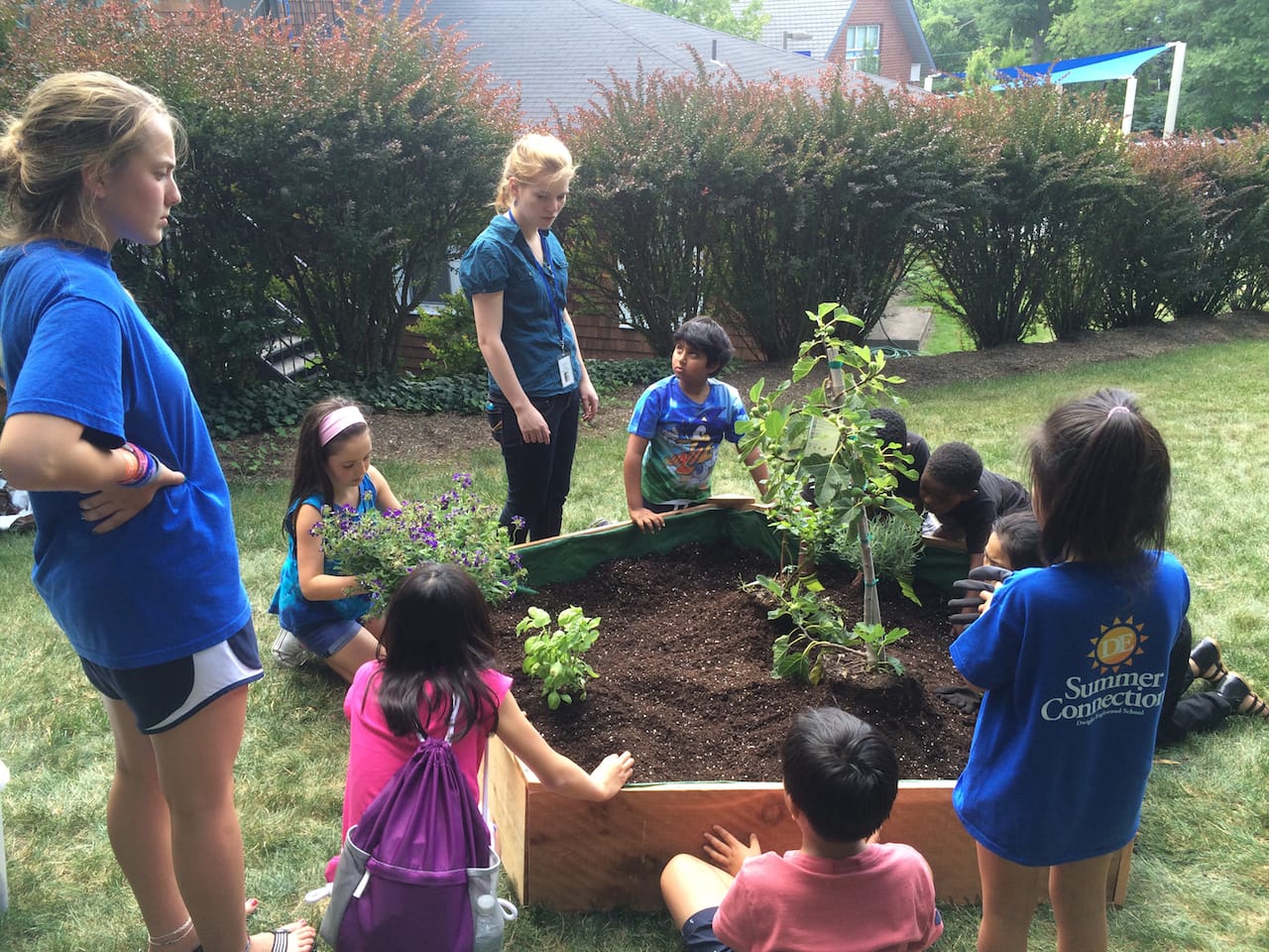 Students at Dwight-Englewood School working on the garden beds for the floating food forest (courtesy Swale)
