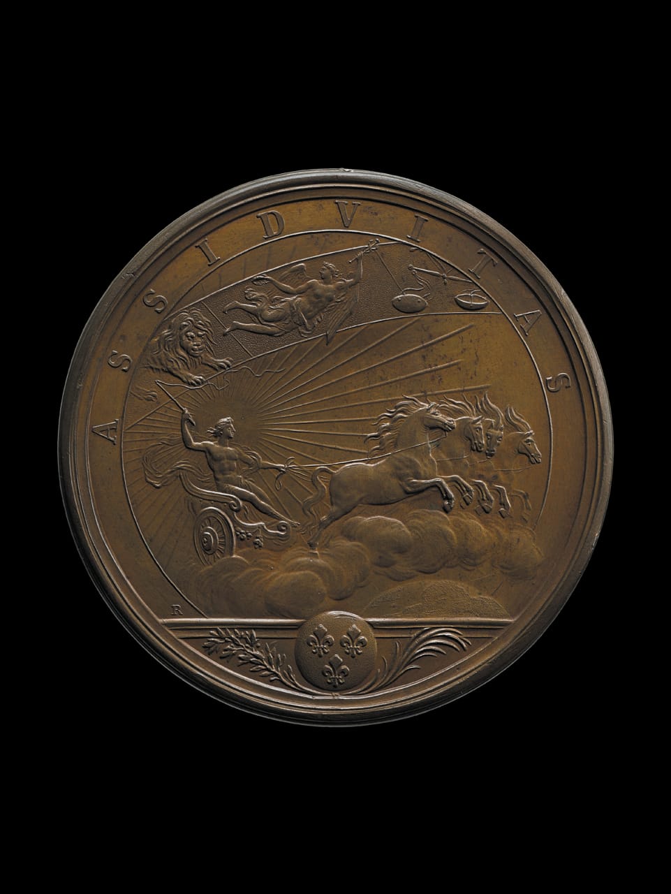 "Hard Work," designed by Renaudot (1661). Louis XIV is represented as Apollo, driving the chariot of the sun which brings light to every part of the earth (© The Trustees of the British Museum)