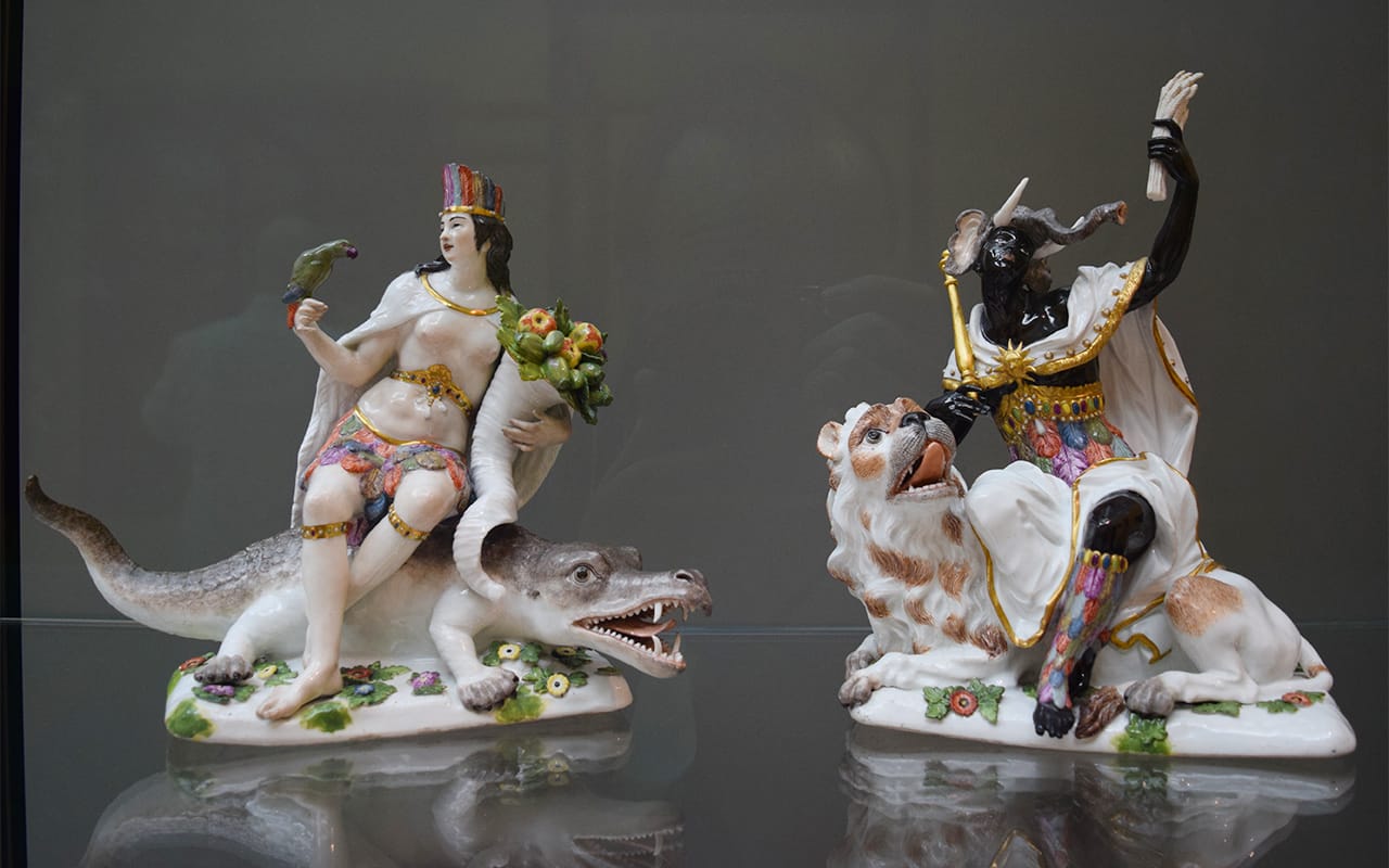 Porcelain figures representing the continents of America (left) and Africa (right) from the Meissen Porcelain Factory (ca. 1760) in the Wadsworth Atheneum's renovated Late Baroque gallery